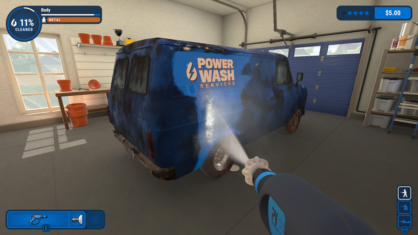 A pressure washer blasting a stripe of clean paint across a dirty blue van in a garage